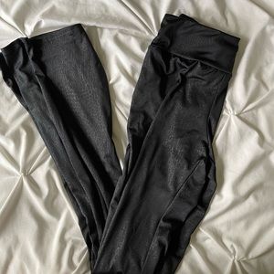Black snakeskin print flare pants
